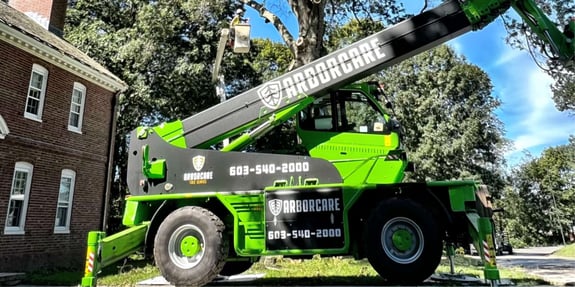 Tree removal truck parked on job site at Phillips Academy